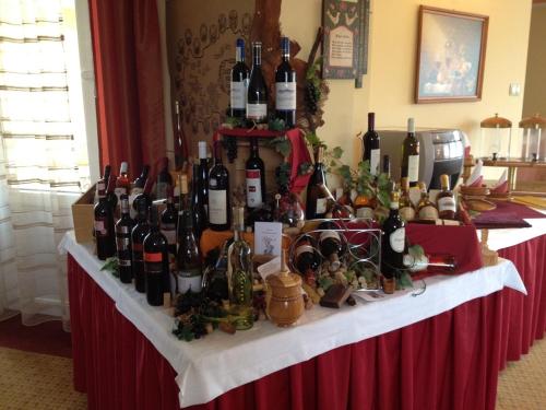 a table filled with lots of bottles of wine at Hotel Lukács Superior in Kazincbarcika
