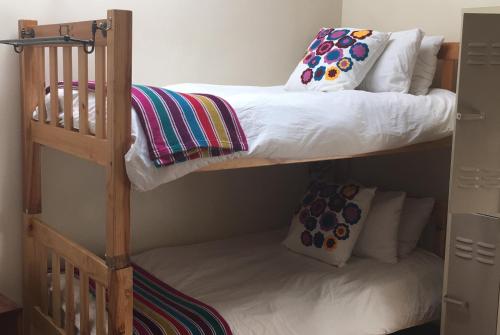 Ένα ή περισσότερα κρεβάτια σε δωμάτιο στο A Sunflower Stop Backpackers