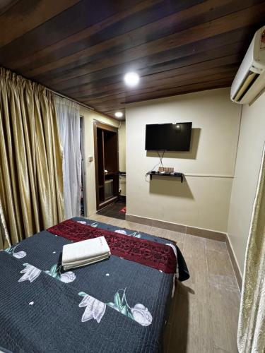 En eller flere senge i et værelse på Norvilla Rooftop Pantai Cenang