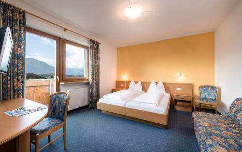 Postel nebo postele na pokoji v ubytování Hotel Am Anger
