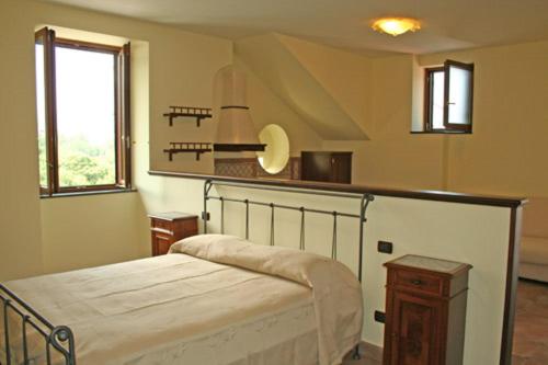 a bedroom with a bed in a room with a window at Milordrelais in Massa Lubrense