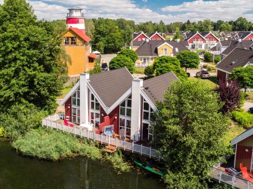 an aerial view of a house with a lighthouse at Marinapark Scharmützelsee in Wendisch Rietz