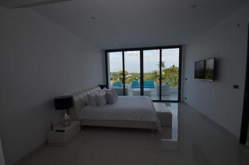 En eller flere senge i et værelse på Sansuri Resort