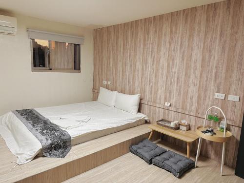 En eller flere senge i et værelse på 辰沐溫泉民宿