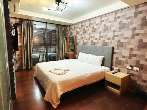 En eller flere senge i et værelse på 辰沐溫泉民宿