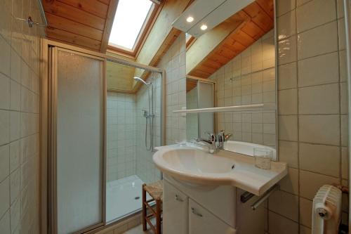 a bathroom with a sink and a shower at Drelo 3 in Verbier