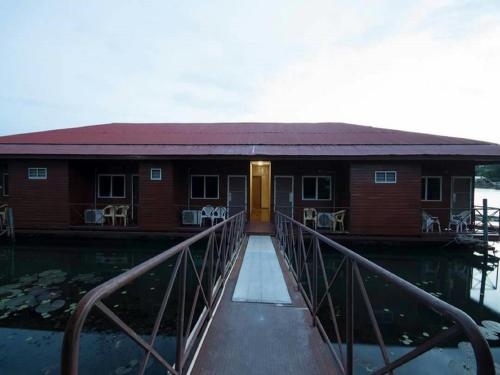 a house on a dock in the water at VN Guesthouse in Kanchanaburi