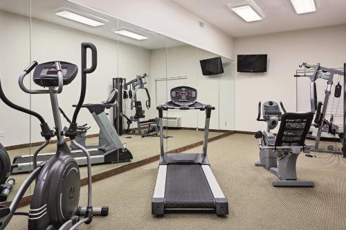 a gym with treadmills and elliptical machines at Americas Best Value Inn - Gun Barrel City in Gun Barrel City