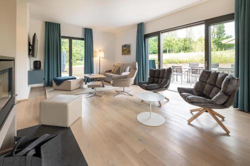 a living room with furniture and a fireplace at Ferienhaus Baltic in Lobbe in Lobbe