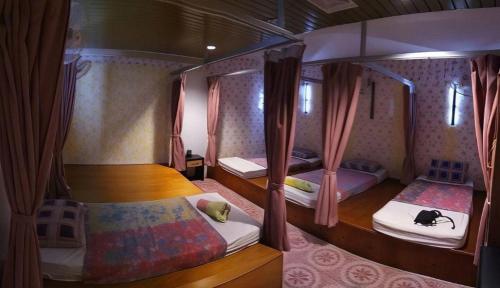 Postel nebo postele na pokoji v ubytování Twin Star Hotel