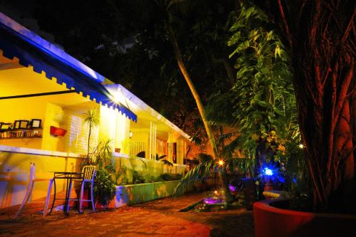 a patio of a house at night with lights at Casa del Caribe Inn in San Juan