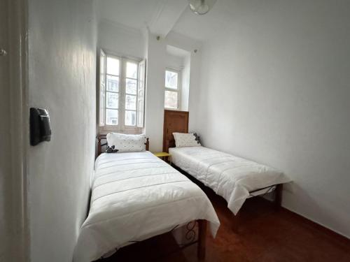 Postel nebo postele na pokoji v ubytování 2 COZ'S apartments central Medina Tetuan