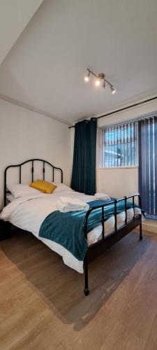 a bedroom with a large bed in a room at Ground Floor Apartment, Garden and free parking - 10 The Rise in Kirkstall