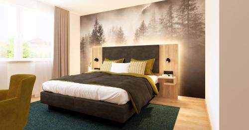 En eller flere senge i et værelse på Wohlfühlhotel zur Grässelmühle