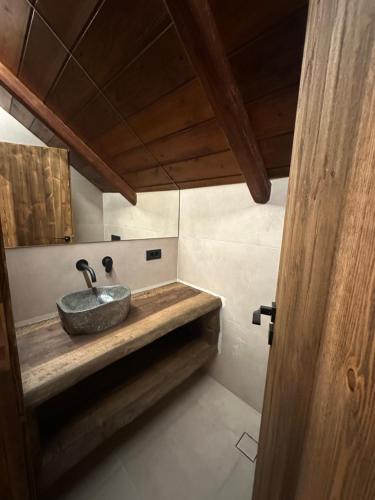 a bathroom with a stone sink in a room at 4 MOUNTAIN HILLS in Méga Khoríon