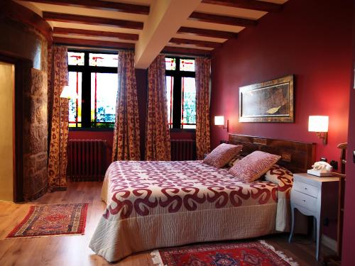 En eller flere senge i et værelse på Hotel Castillo el Collado