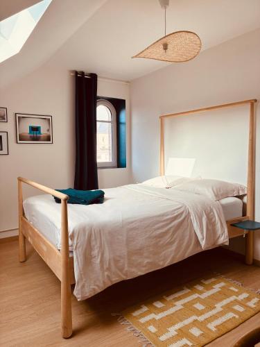 Giường trong phòng chung tại La Maison des Ifs Paon