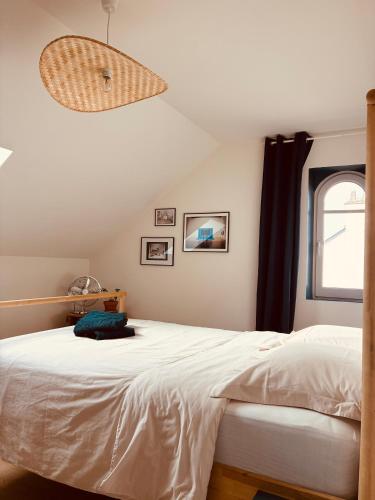 Giường trong phòng chung tại La Maison des Ifs Paon