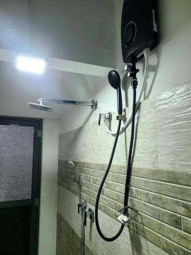 a shower in a bathroom with a shower at Seven S villa in Kamburugamuwa