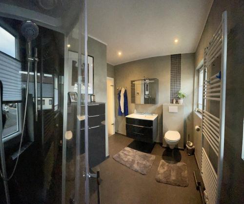 a bathroom with a sink and a toilet at Close to Goettingen - unweit von Göttingen in Nörten-Hardenberg