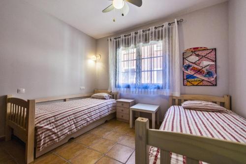 Giường trong phòng chung tại Apartamento Olivia Cotillo Country El Cotillo