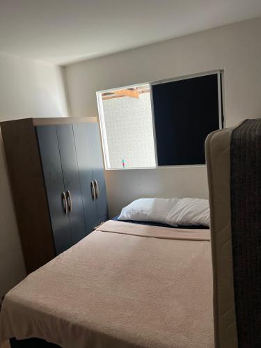 Giường trong phòng chung tại Casa cidade universitária