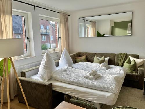 Postel nebo postele na pokoji v ubytování Apartmenthaus Gilden 1