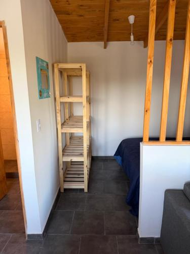 a small room with a ladder and a bed at Freedom in Miramar