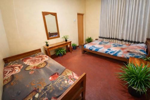 En eller flere senge i et værelse på Yashora Gimanhala