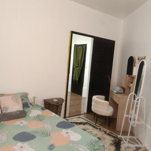 a bedroom with a bed and a mirror at Love Bk Siargao Homestay in General Luna