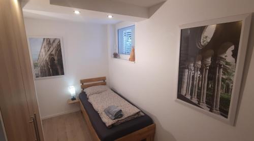 a small room with a small bed in the wall at Green Garden , HOMEANDSAIL in Jezera