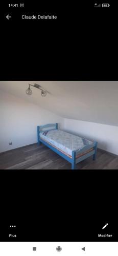 a picture of a bed in a room at Chez Monique in Maubert-Fontaine