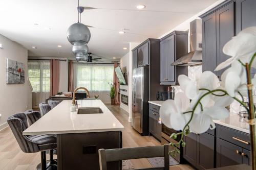 a kitchen with a kitchen island with a counter top at Luxury Urban Escape with Rooftop in downtown Atlanta in Atlanta