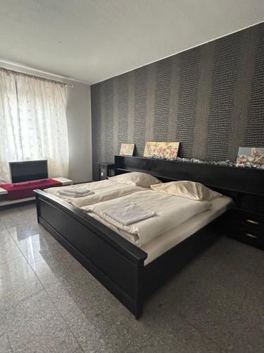 Postel nebo postele na pokoji v ubytování Apex City Apartment