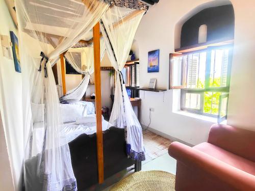 En eller flere senge i et værelse på Seafarers Loft