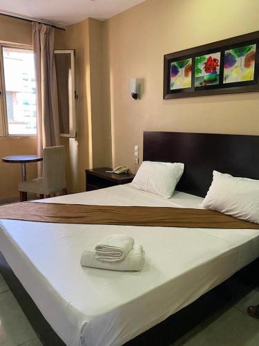 En eller flere senge i et værelse på Hotel kssar