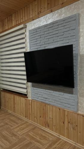 TV a/nebo společenská místnost v ubytování Mountain Hearth