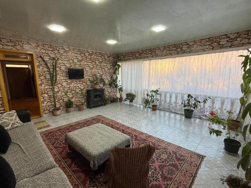 a living room with a couch and a table at Heaven apartment in Gabala