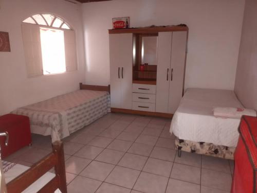 Giường trong phòng chung tại casa 2/4 para descansar