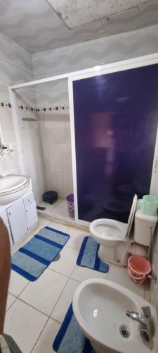 a bathroom with a toilet and a sink at Horizon heights in El Haouma