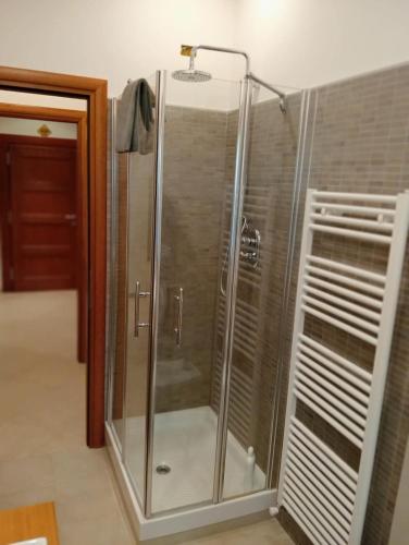 a shower with a glass door in a bathroom at Casa Vacanze Giano in Antrodoco
