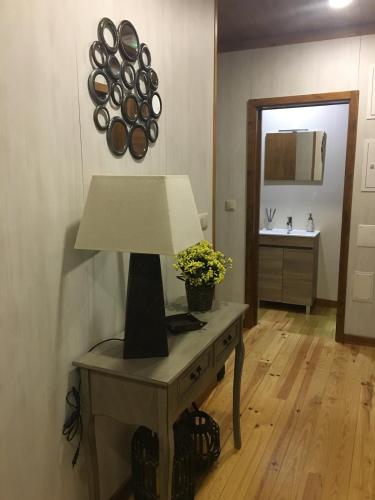 a lamp on a table in a room at Chalé de Montanha in Vieira do Minho