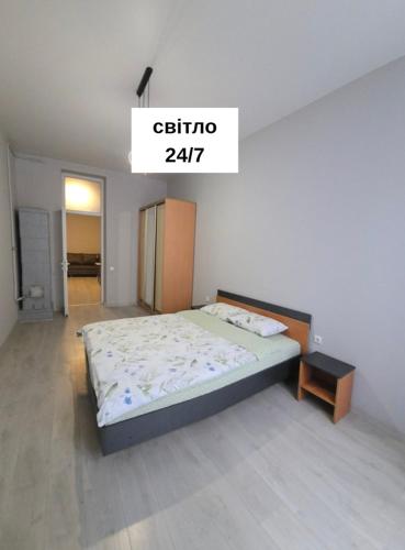 Postel nebo postele na pokoji v ubytování 2х кімнатна апартаменти біля Кобилянської