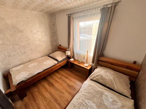 Postel nebo postele na pokoji v ubytování Chata POD HOUBOVÝM VRCHEM