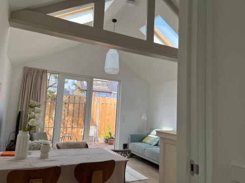 a living room with a table and a couch at Ons Bijhuis in Wijk aan Zee