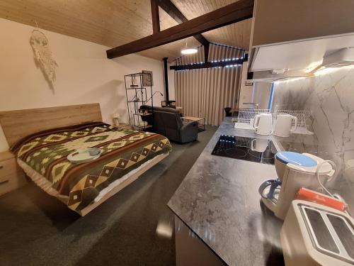 a bedroom with a bed in the middle of a room at Quinta da Portela in Ferro