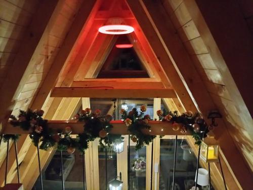 a window in the ceiling of a restaurant with christmas decorations at MajdanskiKutak2 in Gornji Milanovac