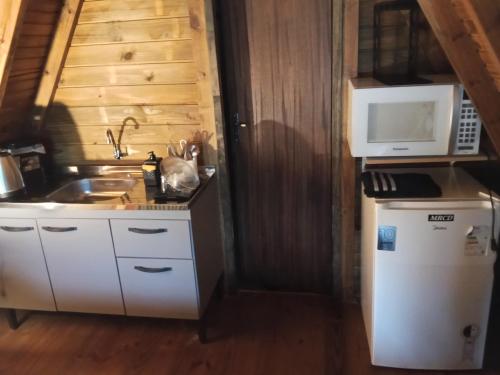 Køkken eller tekøkken på Pousada Vale das Pedras 01