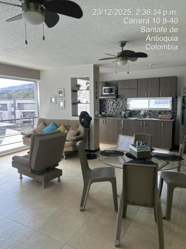 a living room with a couch and a table at Hermoso Apartasol en Santa Fe de Antioquia!!! in Santa Fe de Antioquia