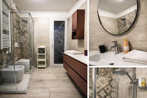 a bathroom with a shower and a sink and a mirror at QUEEN HOME Luana in Venice